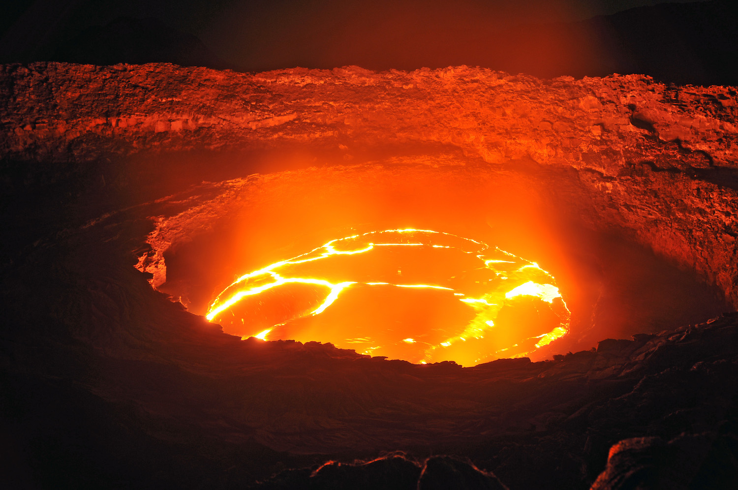 Bright molten lava lake illuminating the Erta Ale crater.