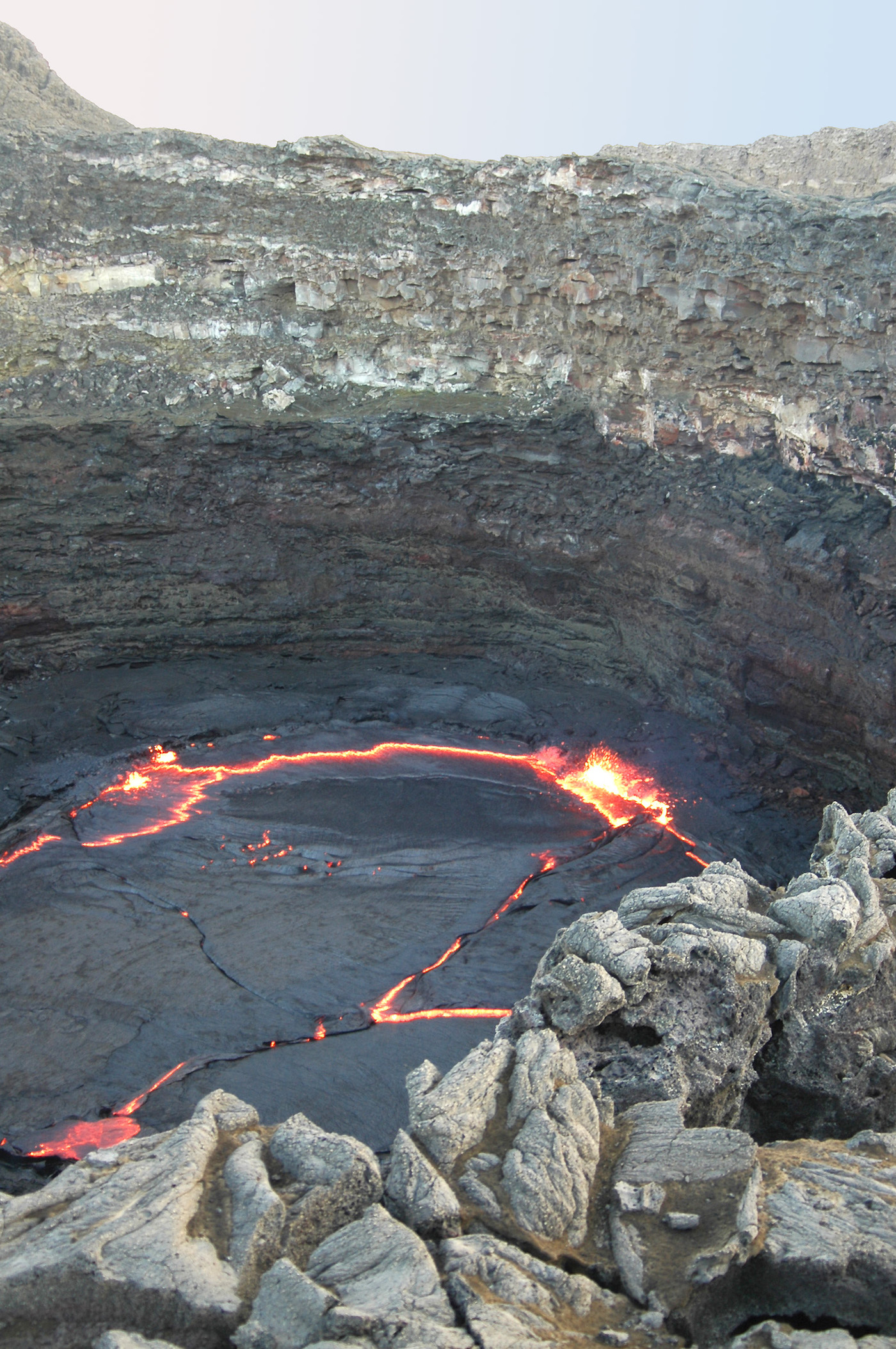 The glowing lava lake at Erta Ale under the night sky.