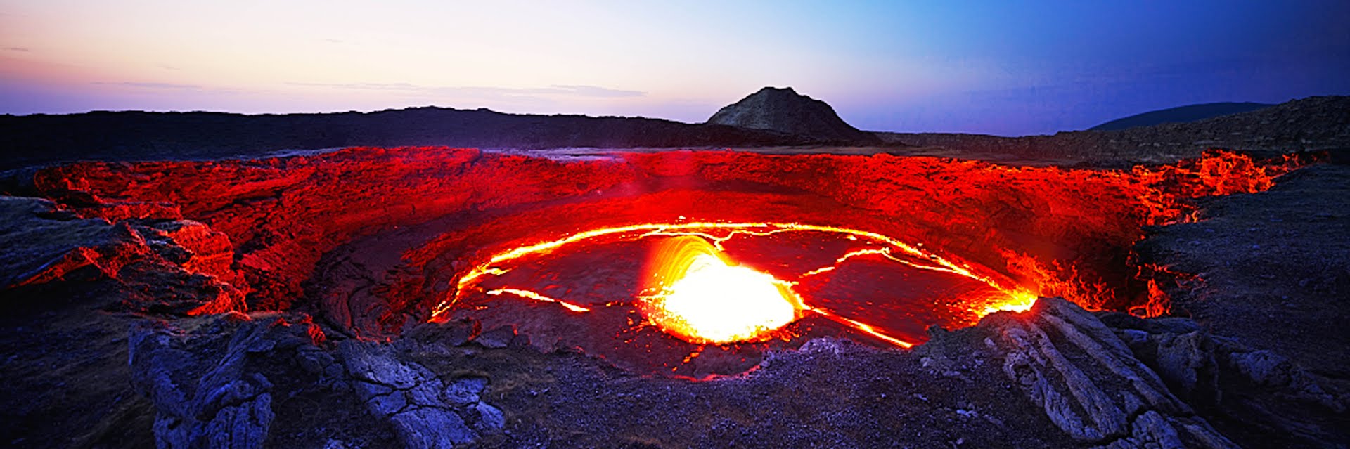 Panoramic sunset view of Erta Ale's lava lake.
